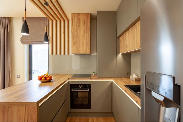 U-shaped kitchen with exposed brick